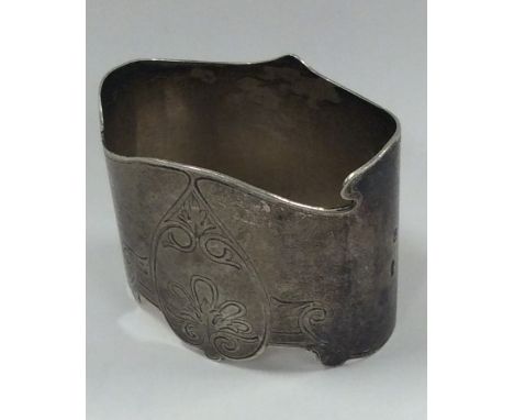 A heavy Russian silver napkin ring decorated with scrolls. Approx. 36 grams. Est. £20 - £30.