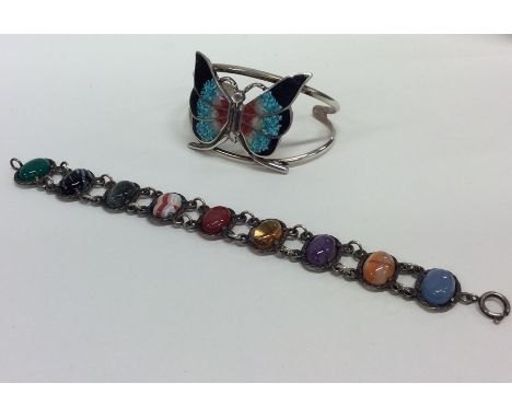 A silver and agate bracelet together with an enamel bangle. Approx. 74 grams. Est. £20 - £30.