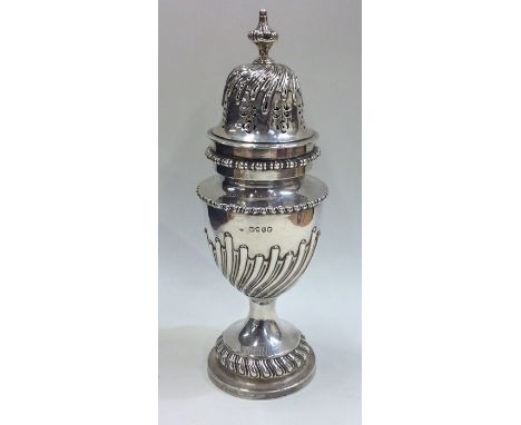 A massive Victorian silver half fluted sugar caster with lift-off cover. Approx. 23 cms high. Approx. 384 grams. Est. £250 - 
