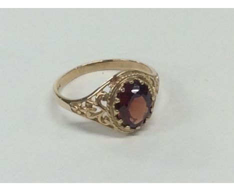 A 9 carat garnet single stone ring. Approx. 2.3 grams. Est. £40 - £60.