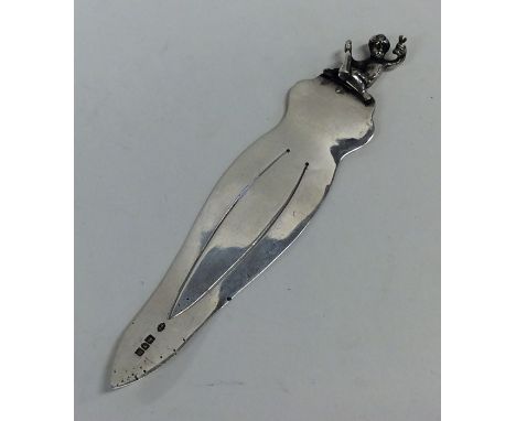 A small novelty silver bookmark decorated with a figure. London. by WC. Approx. 19 grams. Est. £15 - £20.