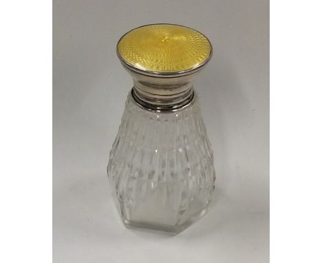 A silver and enamel scent bottle. Approx. 100 grams. Est. £20 - £30.