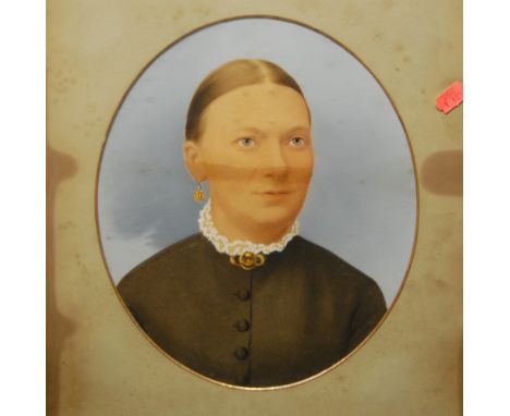 A pair of overpainted portrait prints, framed and glazed