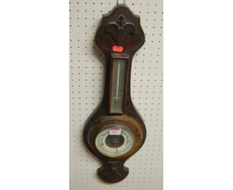 An oak aneroid wheel barometer