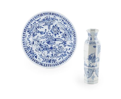TWO PIECES OF BLUE AND WHITE DELFTWARE18TH CENTURY comprising a charger densely decorated with birds, a dog, and rabbit among