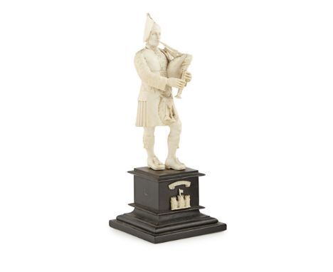 CARVED IVORY FIGURE OF A ROYAL INNISKILLING FUSILIERLATE 19TH/ EARLY 20TH CENTURY carved as a standing, kilted fusilier playi