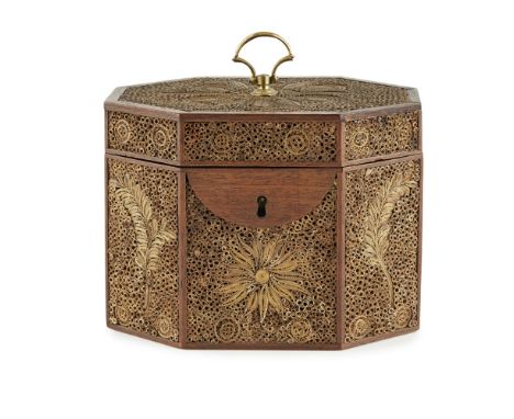 GEORGE III PAPER SCROLL TEA CADDY18TH/ EARLY 19TH CENTURY of octagonal form, the mahogany frame enclosing gilded paper scroll