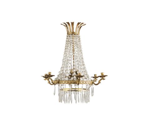 GILT METAL AND CUT GLASS CHANDELIEREARLY 20TH CENTURY the gilt metal feather corona above cut glass beaded swags and gilt met