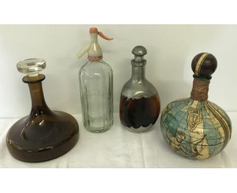 4 vintage glass decanters. To include brown glass ships decanter. 
