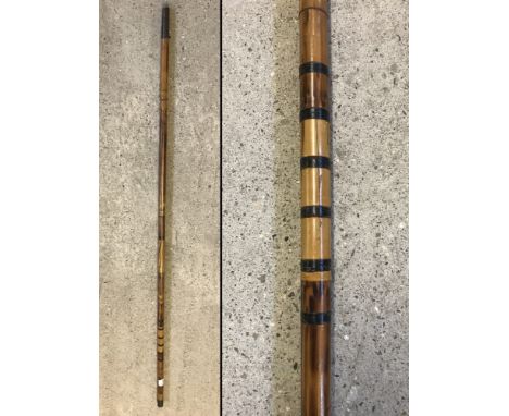 1 piece bamboo Hollow Stick fishing rod by Ghillies c1920. Screw threaded brass end. Rod tip 64". 