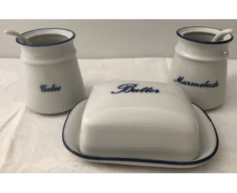 A  set of 3 blue and white ceramic condiments. Comprising butter dish, marmalade pot and spoon and a gelee pot and spoon. 