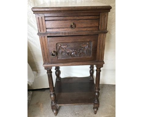 Oak pot cupboard with white marble top. With drawer. Cupboard has carved detail to front. Turned legs. Bottom shelf. Approx 8