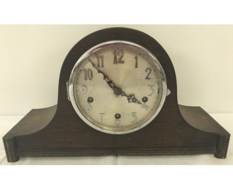 A vintage dark wood cased Westminster Chime napoleon hat mantel clock. With key and pendulum, in working order. 