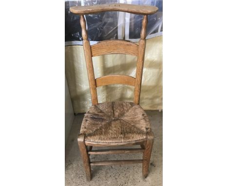 A vintage pine rush seated chapel chair. With initials K M to back. 
