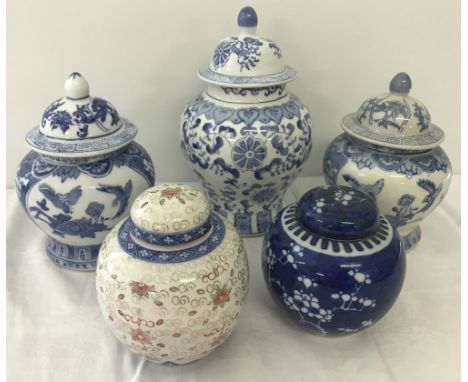 5 ceramic oriental lidded ginger jars with hand painted decoration. 2 with cork inserts. Largest approx. 27cm tall.
