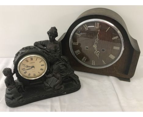 A vintage wooden cased Smiths mantel clock with roman numeral batons to face. Complete with key and pendulum. Together with a