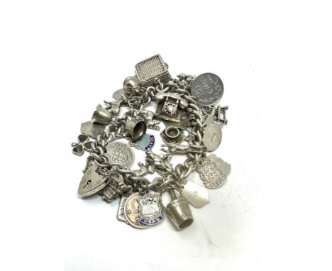 A vintage silver charm bracelet with assorted novelty charms (98g) 