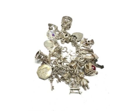 A vintage silver charm bracelet with assorted novelty charms (79g) 
