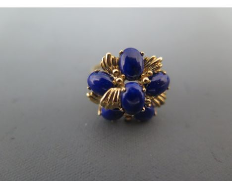 A 9ct yellow gold and blue stone cluster ring size L - approx weight 3.5 grams - minor usage wear