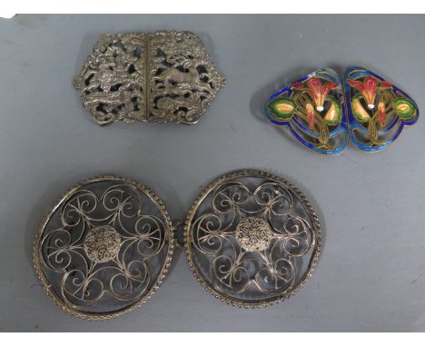 An Eastern "Hunt" white metal buckle, an enamel buckle and a plated buckle - some enamel loss and general usage wear to all