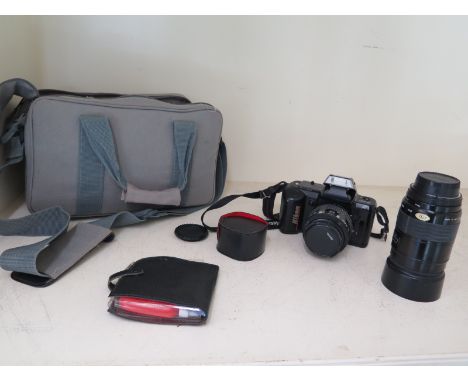 A Nikon F-401 35mm camera with 35-70mm lense F=75-200mm lense bag 2 x converter etc
