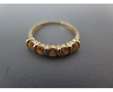 A 9ct yellow gold and five stone ring size T - approx weight 2 grams - some minor usage wear