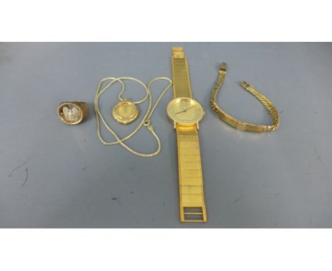 A Franklin Mint Eagle watch with gold plated dial and associated jewellery consisting of a silver gilt ring with 14ct gold co