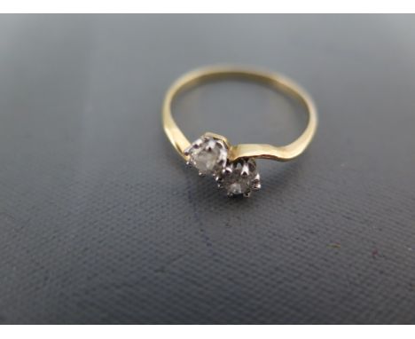 An 18ct yellow gold and diamond crossover ring size N - approx weight 1.5 grams - minor usage wear