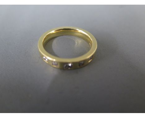 An 18ct yellow gold ring set with five square cut diamonds ring size Q/R - approx weight 8.1 grams