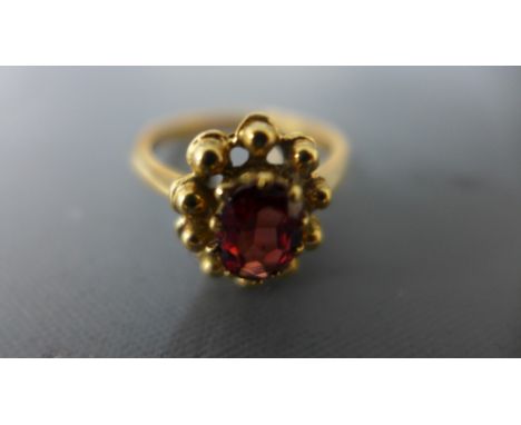 A 9ct yellow gold and ruby ring size T/U - approx weight 4.7 grams - clean and bright, some usage wear