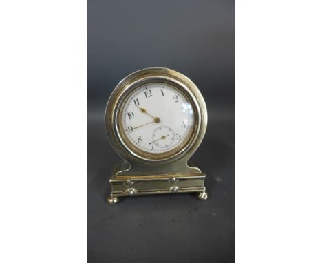 A small silver cased bedside clock - Height 7.5cm - not working, some rubbing to case - marked 80 with hallmarks