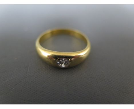 A diamond solitaire ring set in 18ct yellow gold - approx weight 2.3 grams - ring size N - clean and bright