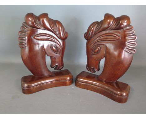A pair of Art Deco wooden horse head book ends, London retailers and makers mark to base circa 1930 - Height 22cm - repair to