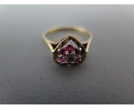 A 9ct yellow gold ruby and diamond ring size L - approx weight 2.2 grams - minor usage wear