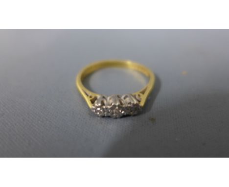 An 18ct yellow gold and three stone diamond ring - approx weight 2.8 grams - ring size N - clean and bright