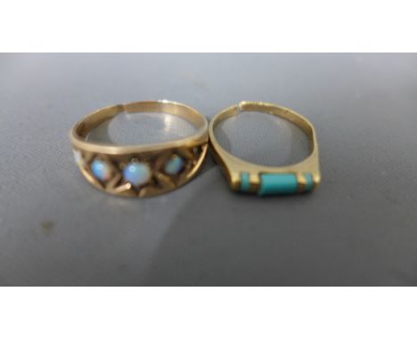 A 10ct yellow gold ring with turquoise and opal to shoulder - one opal missing, ring dented to back - approx weight 2.6 grams