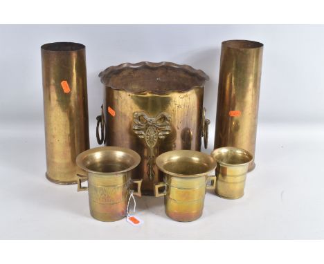 A COLLECTION OF TRENCH ART, to include Loving Cups, beaker, planter and shells, the loving cups have twin handles and a decor