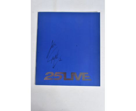 A SIGNED 25LIVE GEORGE MICHAEL PROGRAMME, 35cm x 30cm, signed to the front blue panel