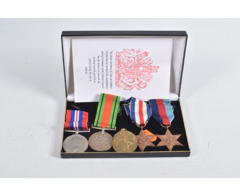 A WWI VICTORY MEDAL AND FOUR WWII MEDALS, the Victory medal is named to Private 11906 Hugh Lear Devonshire Regiment, Mr. Lear