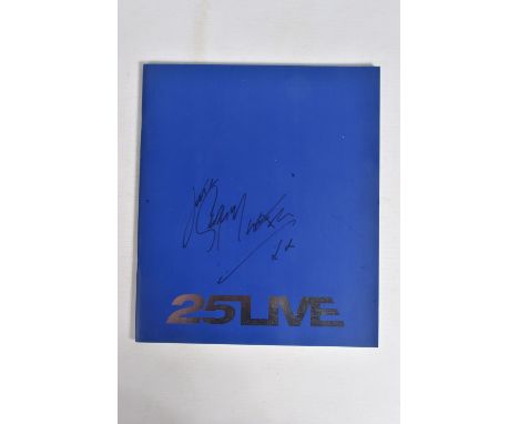 A SIGNED 25LIVE GEORGE MICHAEL PROGRAMME, 35cm x 30cm, signed to the front blue panel