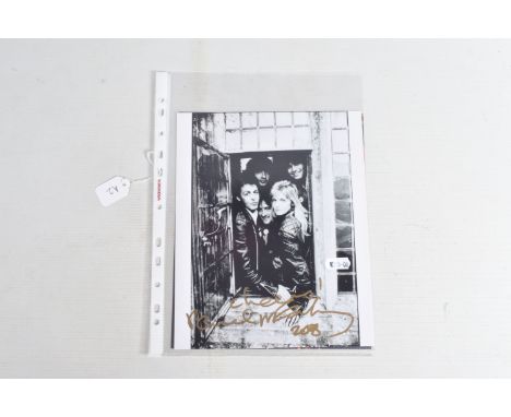 TWO SIGNED 10   X 8   PHOTOGRAPHS OF PAUL McCARTNEY, the first is a black and white photograph of Paul McCartney with the ban