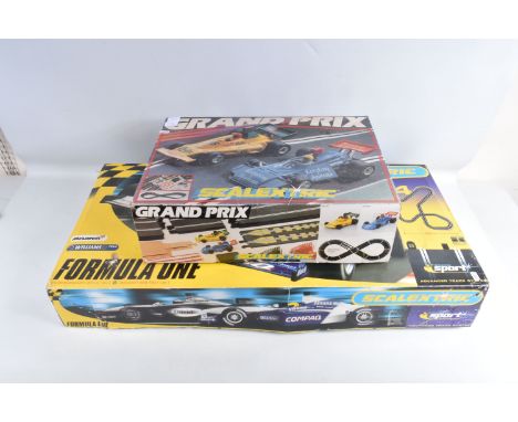 TWO BOXED VINTAGE SCALEXTRIC RACING SETS, to include a two car Grand Prix set, number C698,  it is in good condition and appe