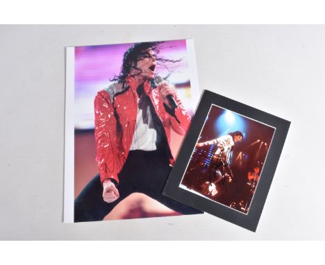 TWO SIGNED PHOTOGRAPHS OF MICHAEL JACKSON, one is framed with a mat 12   x 10   signed in black marker and a 16   x 12   sign
