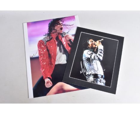 TWO SIGNED PHOTOGRAPHS OF MICHAEL JACKSON, one is framed with a mat 12   x 10   signed in silver marker and a 16   x 12   sig