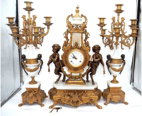 A French marble + brass guilded mantel clock and candle sticks ,
 in very good condition, 
Heavy solid item