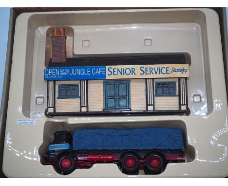 An Albion Reiver sheeted platform lorry - W H Malcolm Ltd + Jungle Cafe ornament, Model CC11603,
In excellent condition