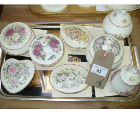 A Collection of Coalport trinket boxes comprising " The pumpkin box " , heart shaped box, " The Minerva box" and others c/w c