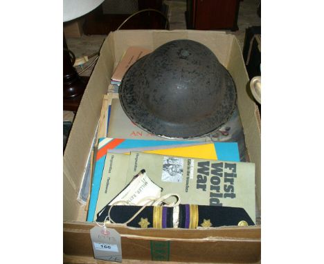 A WW II tin helmet, Navy tunic epaulettes, military ephemera , vintage shop scales and weights , etc.