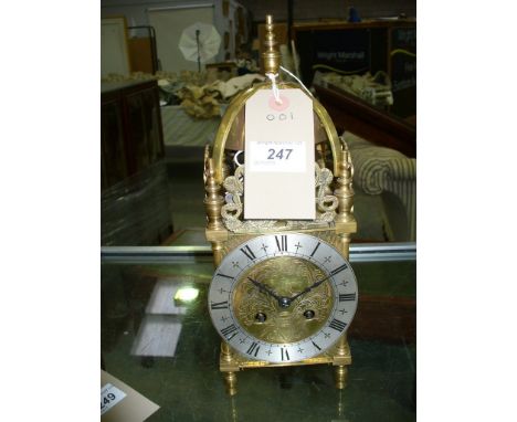 An Early 20th century brass cased lantern clock with a two train Japy Freres movement stamped "Made in France", the case with