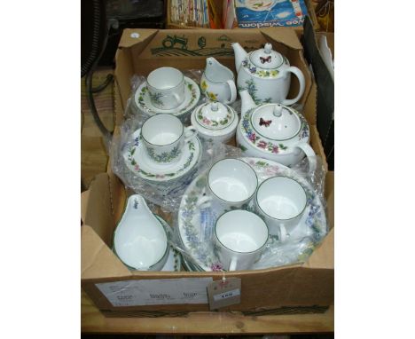 A Royal Worcester " Herbs " pattern tea and dinner service comprising cups, saucers, dinner plates, sauce boat, tea and coffe